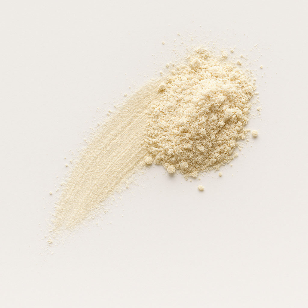 Pile of beige powder on a white background.