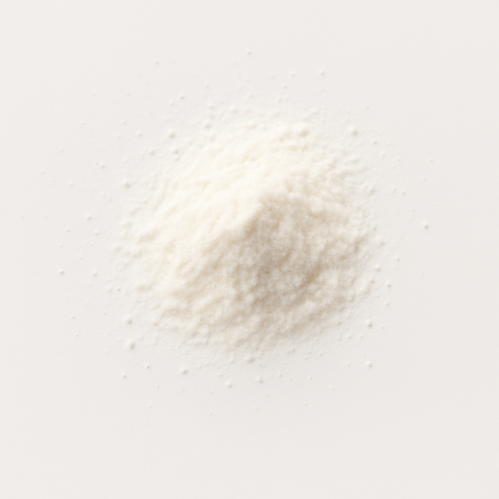 A small pile of white powder on a white surface.