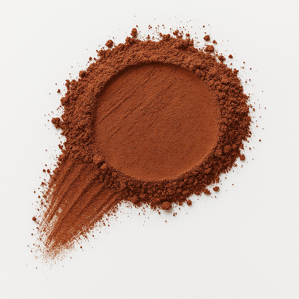 Pile of brown powder on a white background.