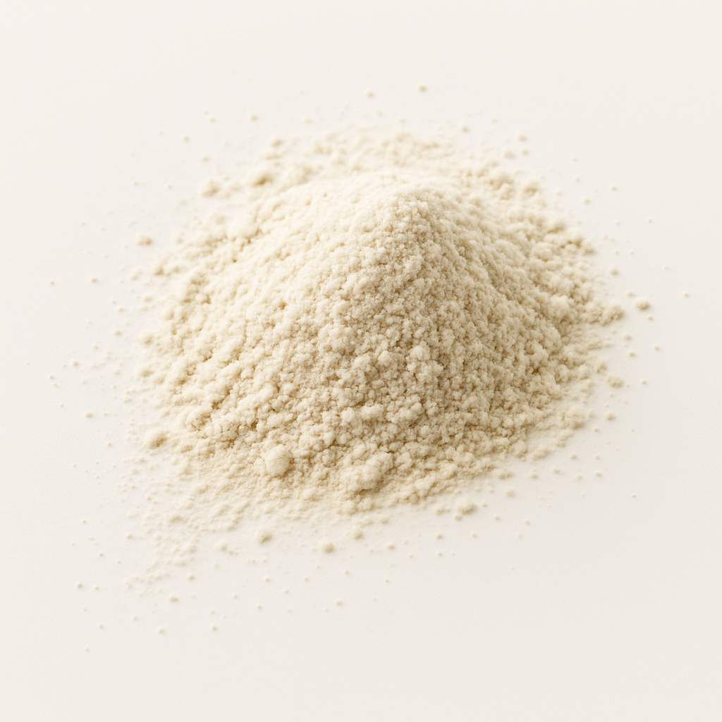 A pile of fine, white powder on a plain background.
