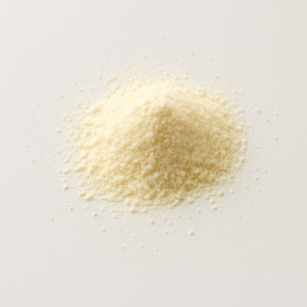 A small pile of fine, light-colored powder on a white surface.