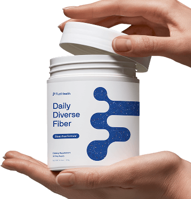 Hands holding a container labeled 'Daily Diverse Fiber' with a white and blue design.