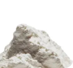 A small pile of a lumpy, light-colored powder against a white background.