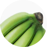 A close-up shot of the top of a bunch of green bananas, cropped into a circular frame.