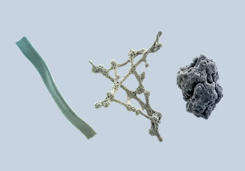 Three distinct textured objects on a gray background.