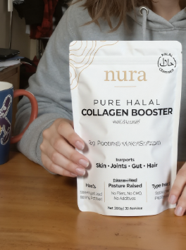 Person holding a bag of Nura Pure Halal Collagen Booster.