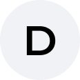 The letter D in black, centered inside a light gray circle.
