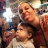 Woman and child making funny faces in a store.