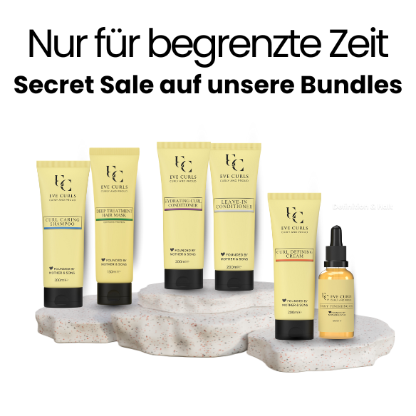 Assorted Eve Curls hair care products displayed on stone slabs.