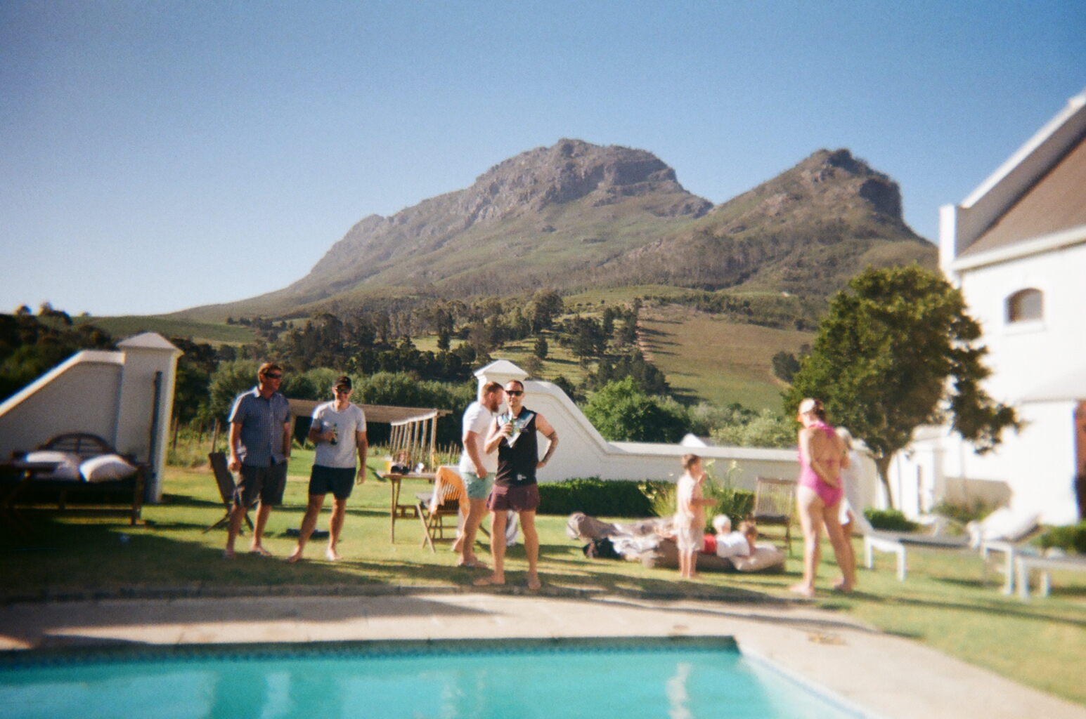 Couple laughing with confetti falling around them at a celebration.