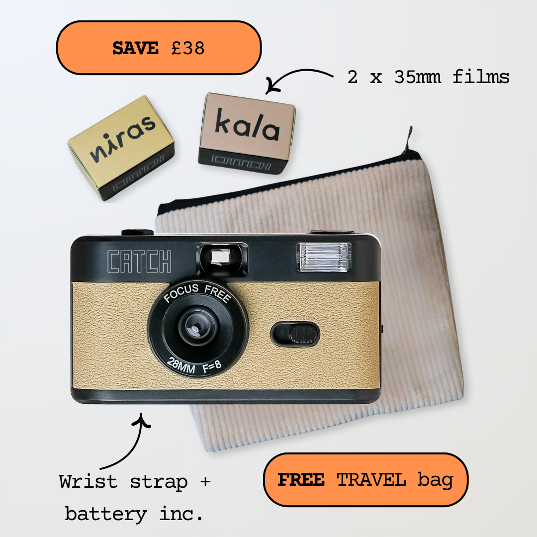 Vintage camera with two film boxes, travel bag, and promotional text.