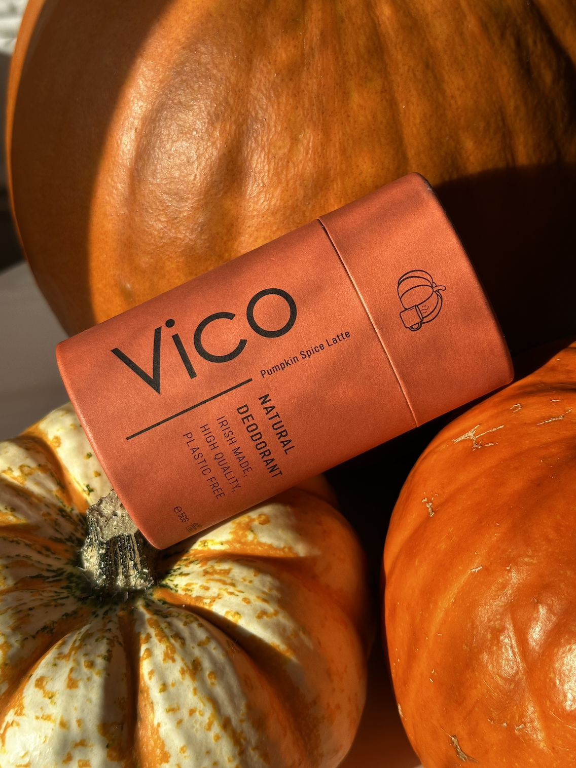 Orange deodorant stick on small pumpkins.