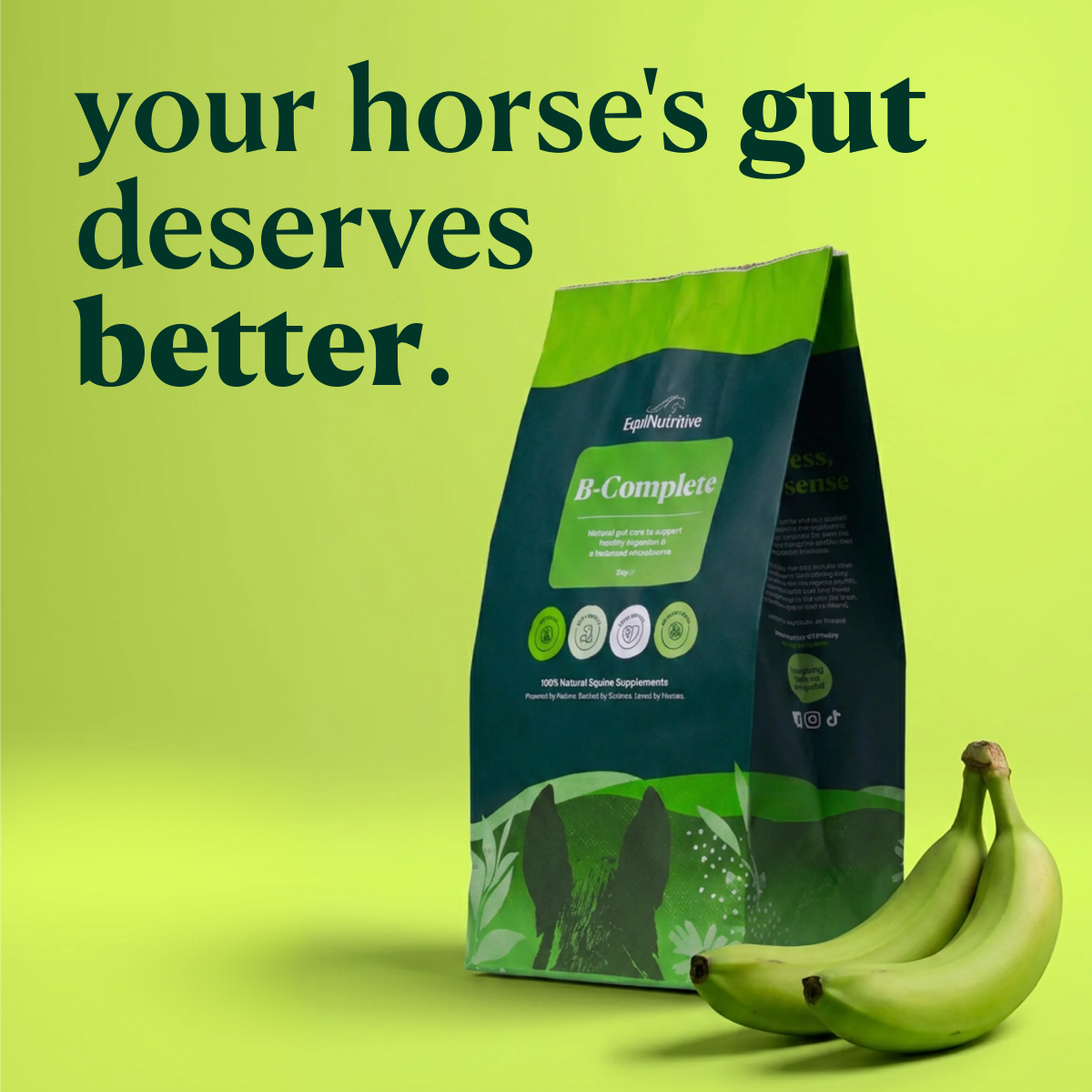 A bag of EquiNutritive B-Complete horse supplement sits next to two green bananas on a green background.