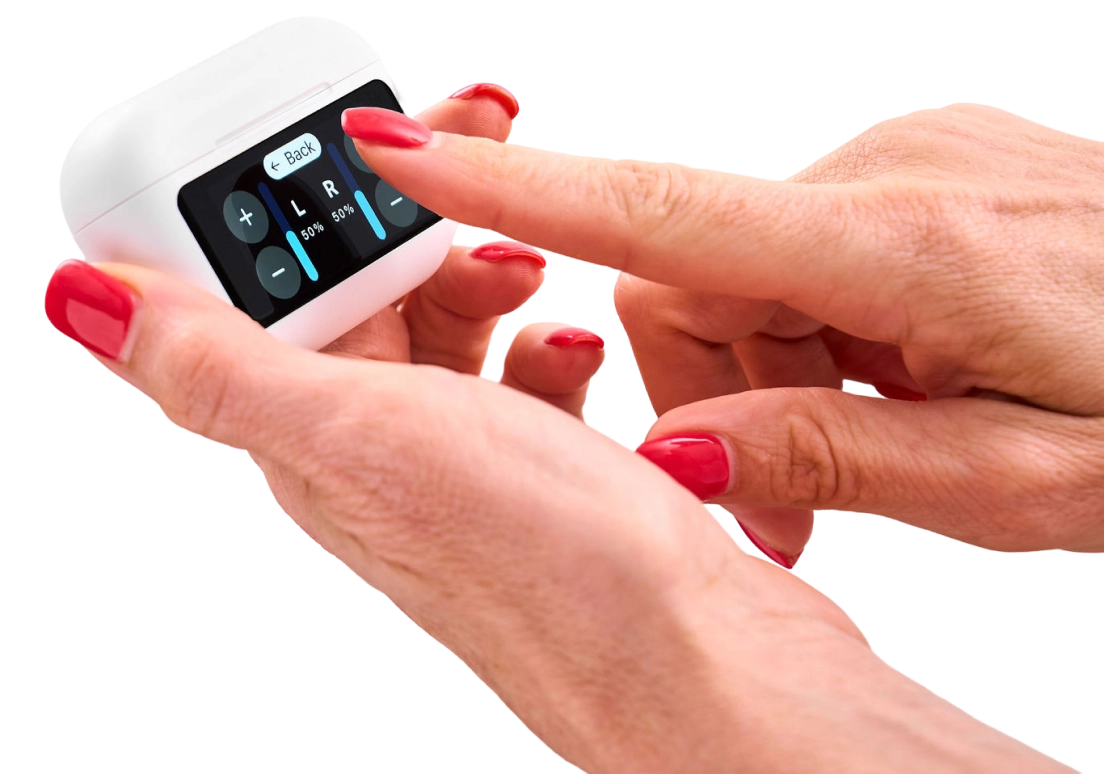 A person adjusting controls on a small device with a touchscreen.