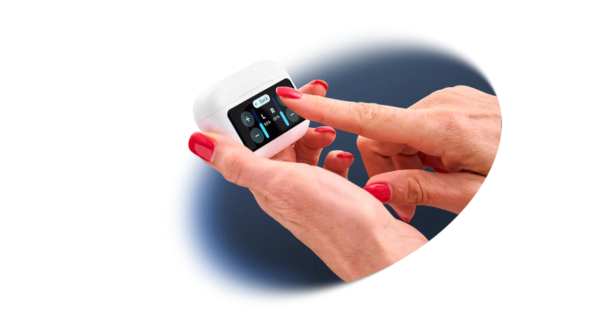 A person with red nail polish interacts with the touchscreen on a white earbud case.