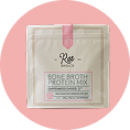 A packet of Rae Wellness Bone Broth Protein Mix set against a pink circular background.