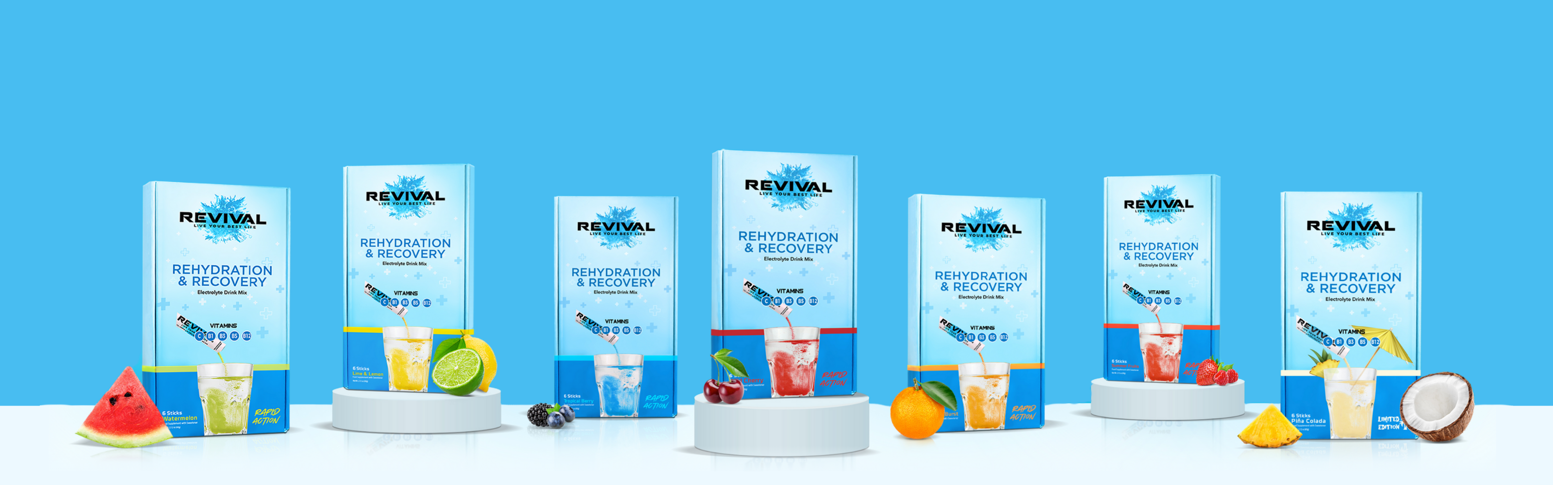 Two Revival packets surrounded by assorted berries on a white background.
