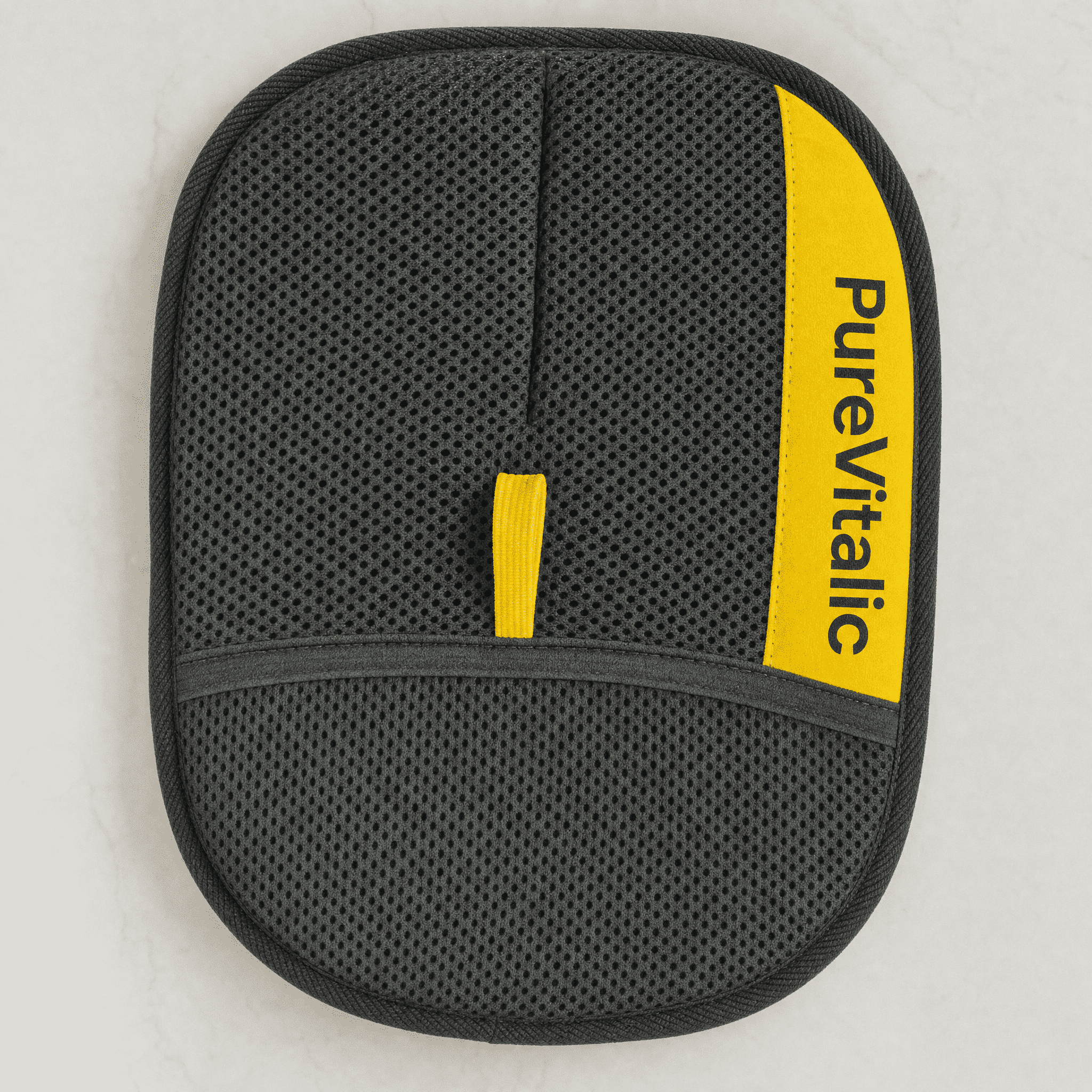 An oval-shaped, black mesh pad with a yellow stripe that reads 'PureVitalic' and a small yellow tab.