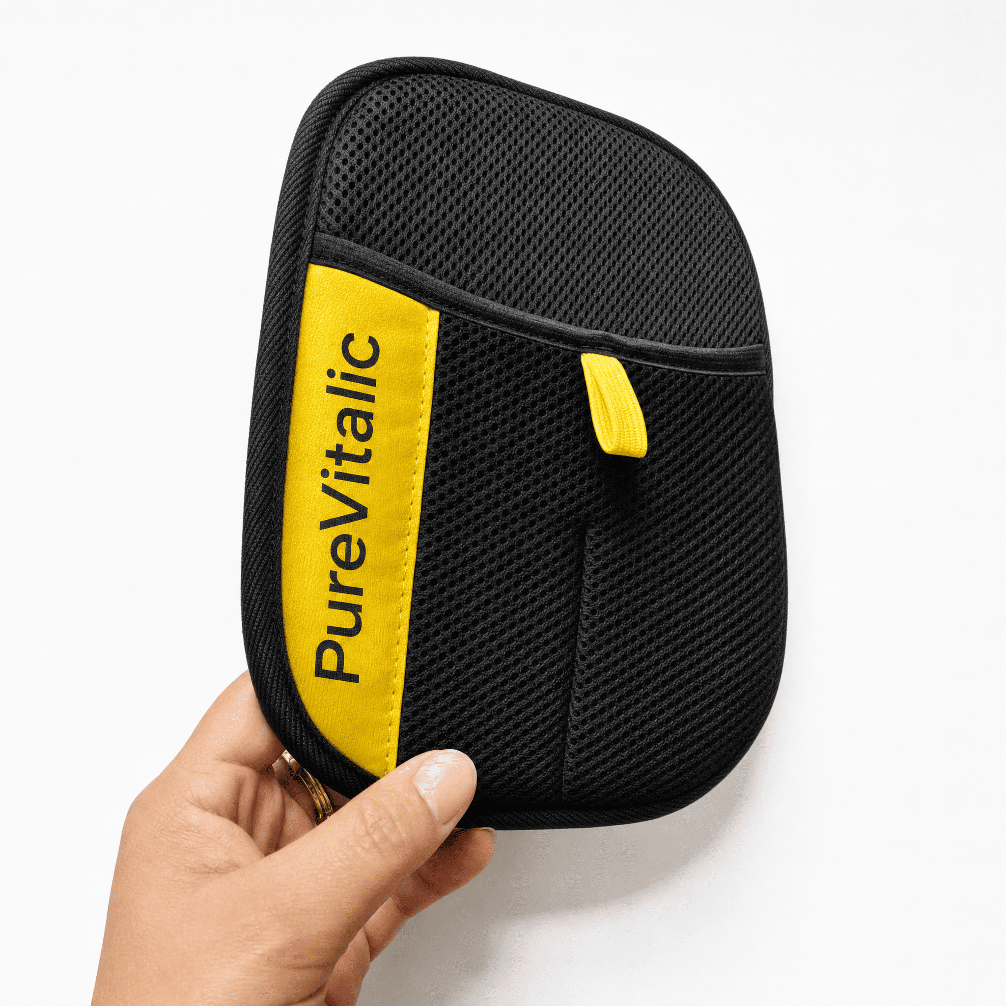 A hand holding a black mesh pouch with a yellow stripe that says 'PureVitalic' against a white background.