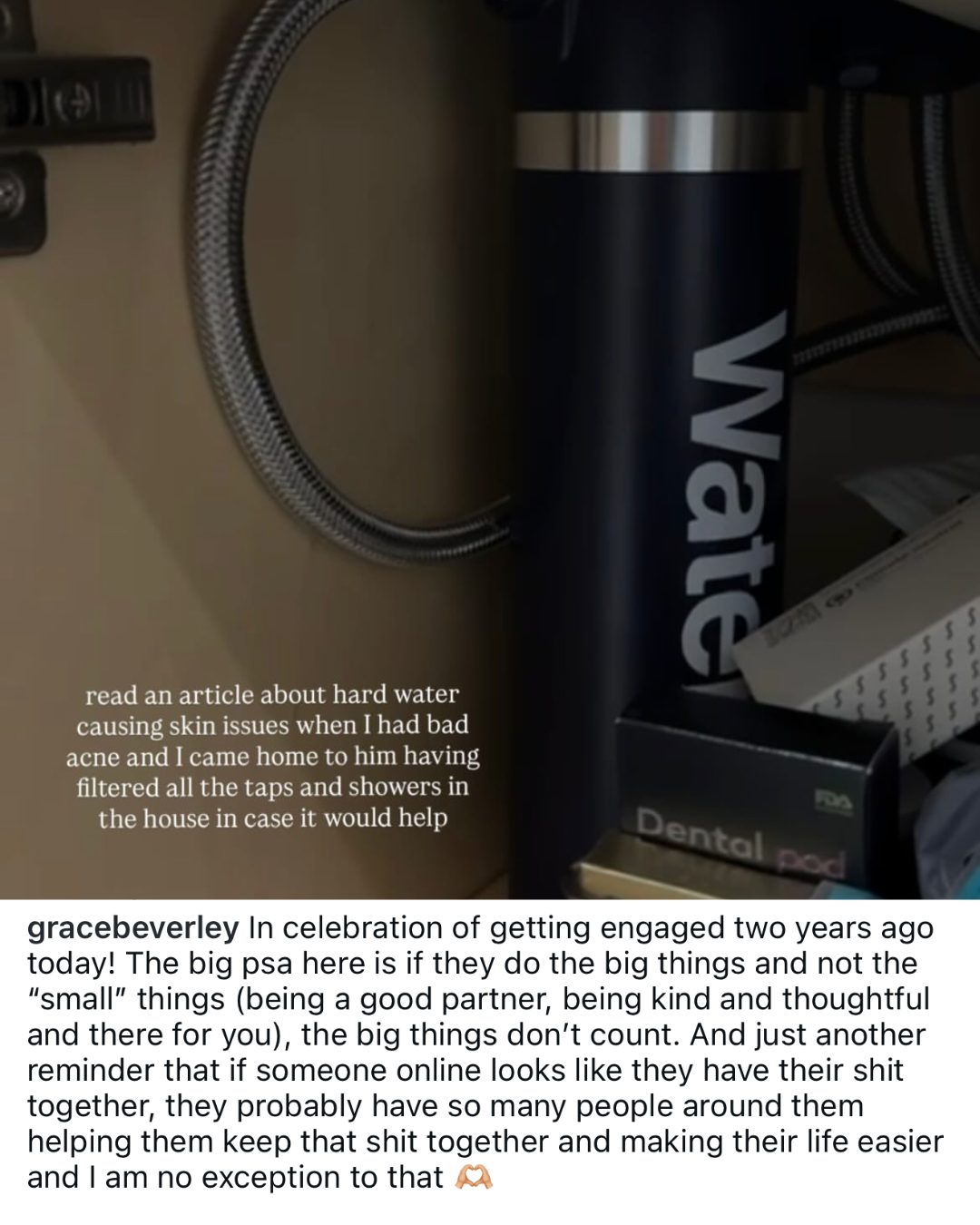 The inside of a cabinet showing a braided hose, a black water bottle, and other items.