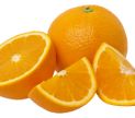 Whole and sliced oranges on a white background.