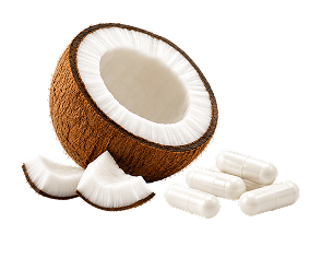 A halved coconut with several pieces of coconut meat and a small pile of white capsules.