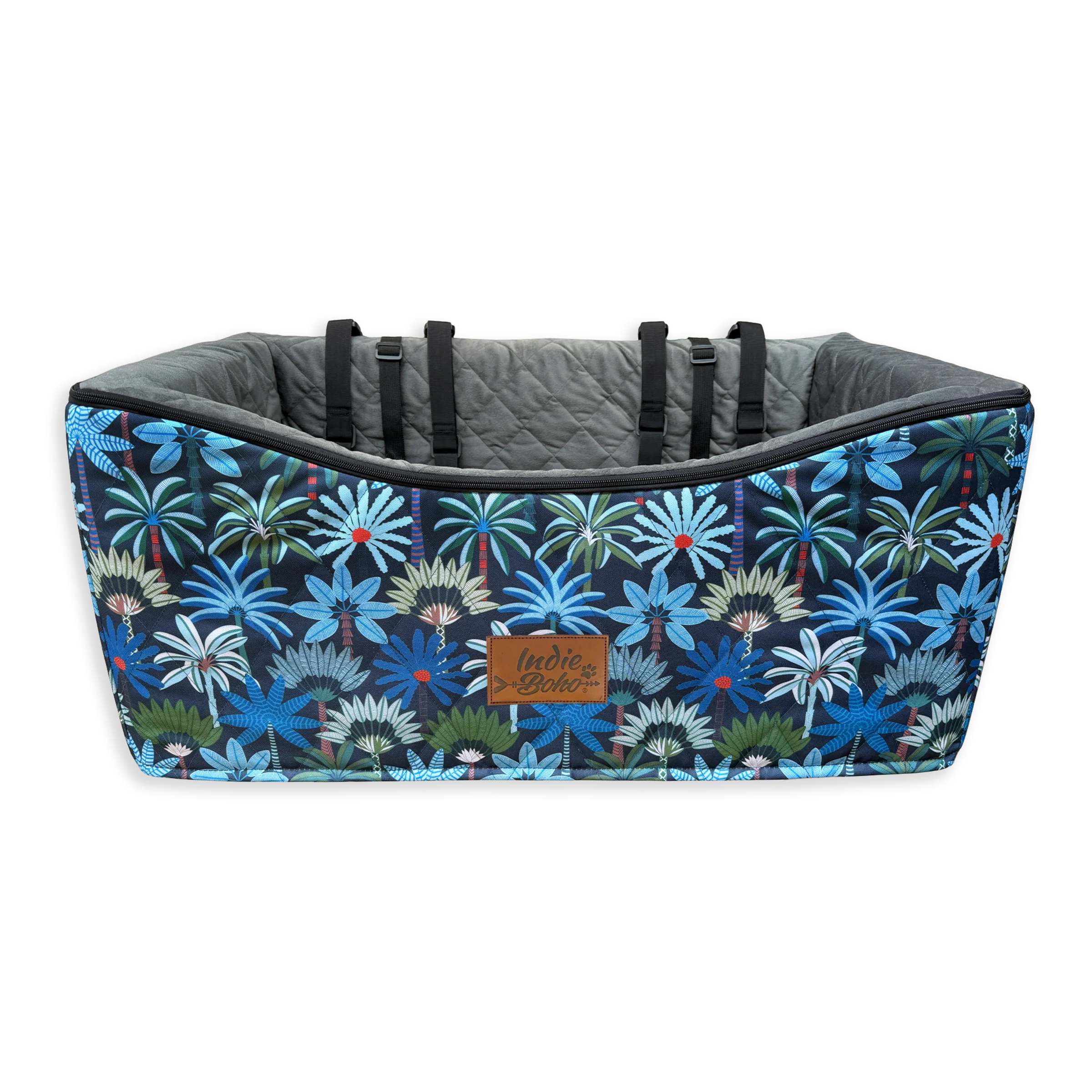 Colorful floral-patterned pet bed with a quilted interior and brand label.