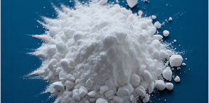A pile of white powder on a blue surface.
