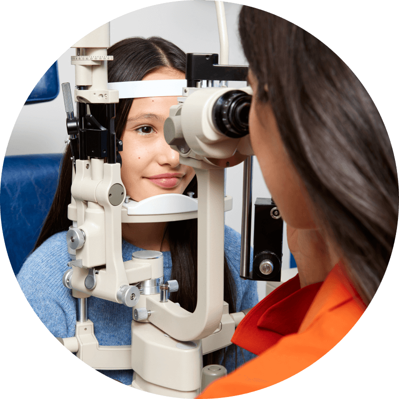 Female child doing a thorough eye exam with an optometrist