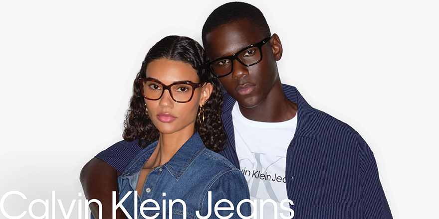Young stylish couple, male and female, wearing Calvin Klein Jeans eye frames.