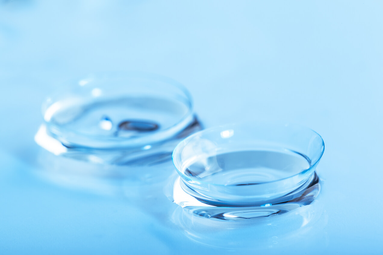 Contact lenses against a blue background