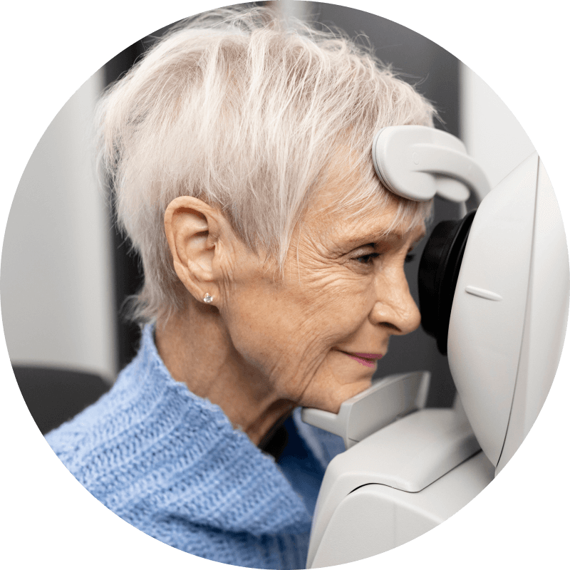 Senior woman doing a thorough eye exam with an specialist