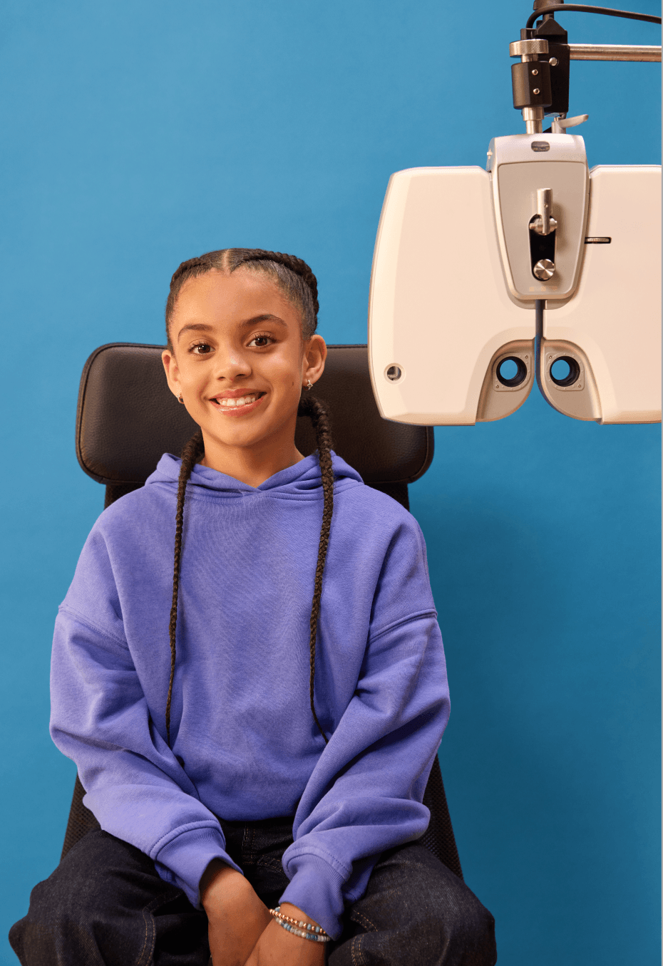Girl at an optometrist office, waiting for her eye exam