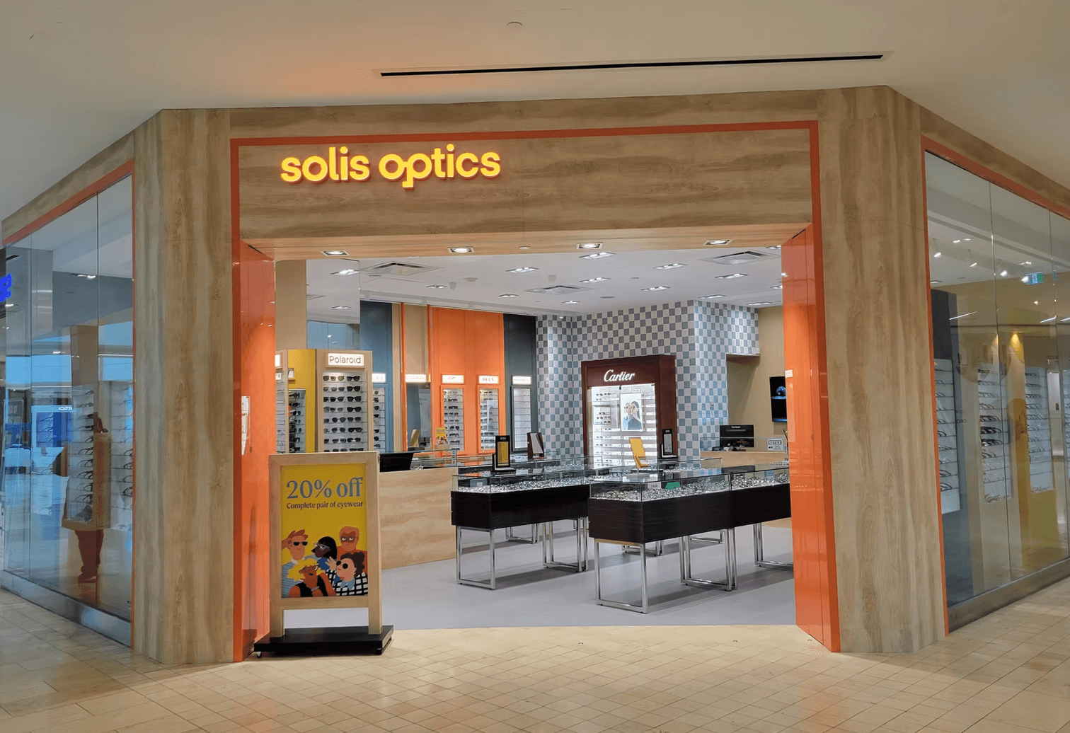The storefront of solis optics, an eyewear store located inside a shopping mall.