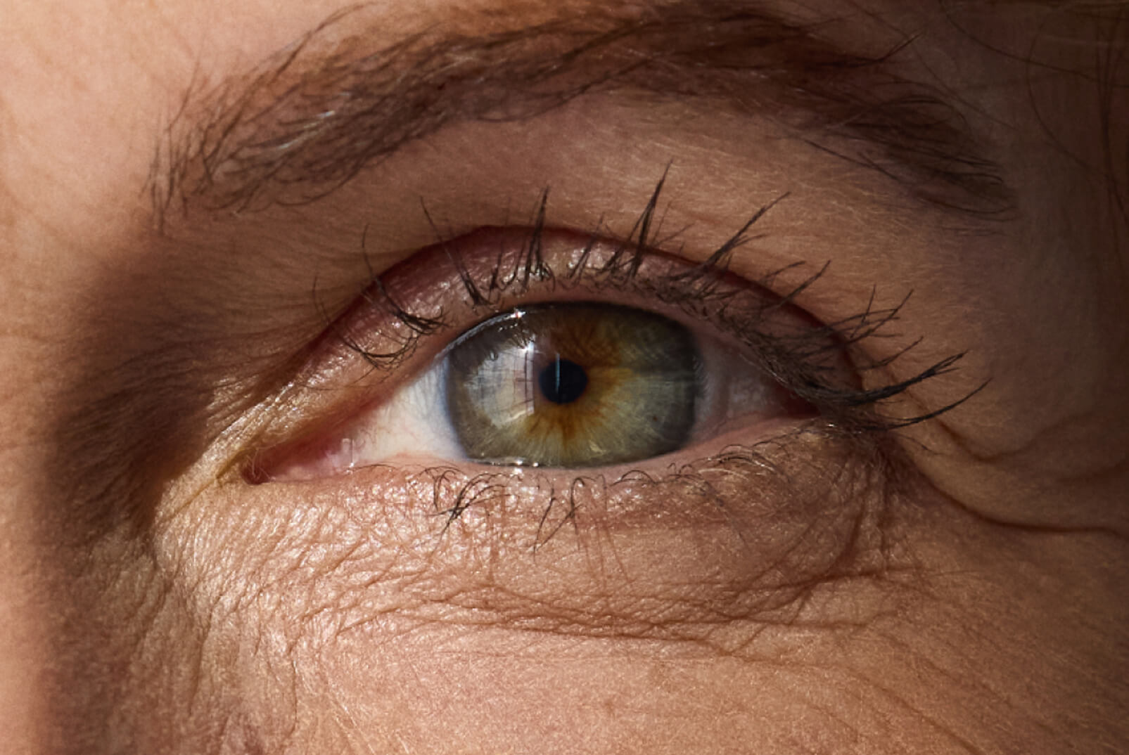 Close-up of an adult eye — presbyopia affects the lens inside the eye, reducing its flexibility with age