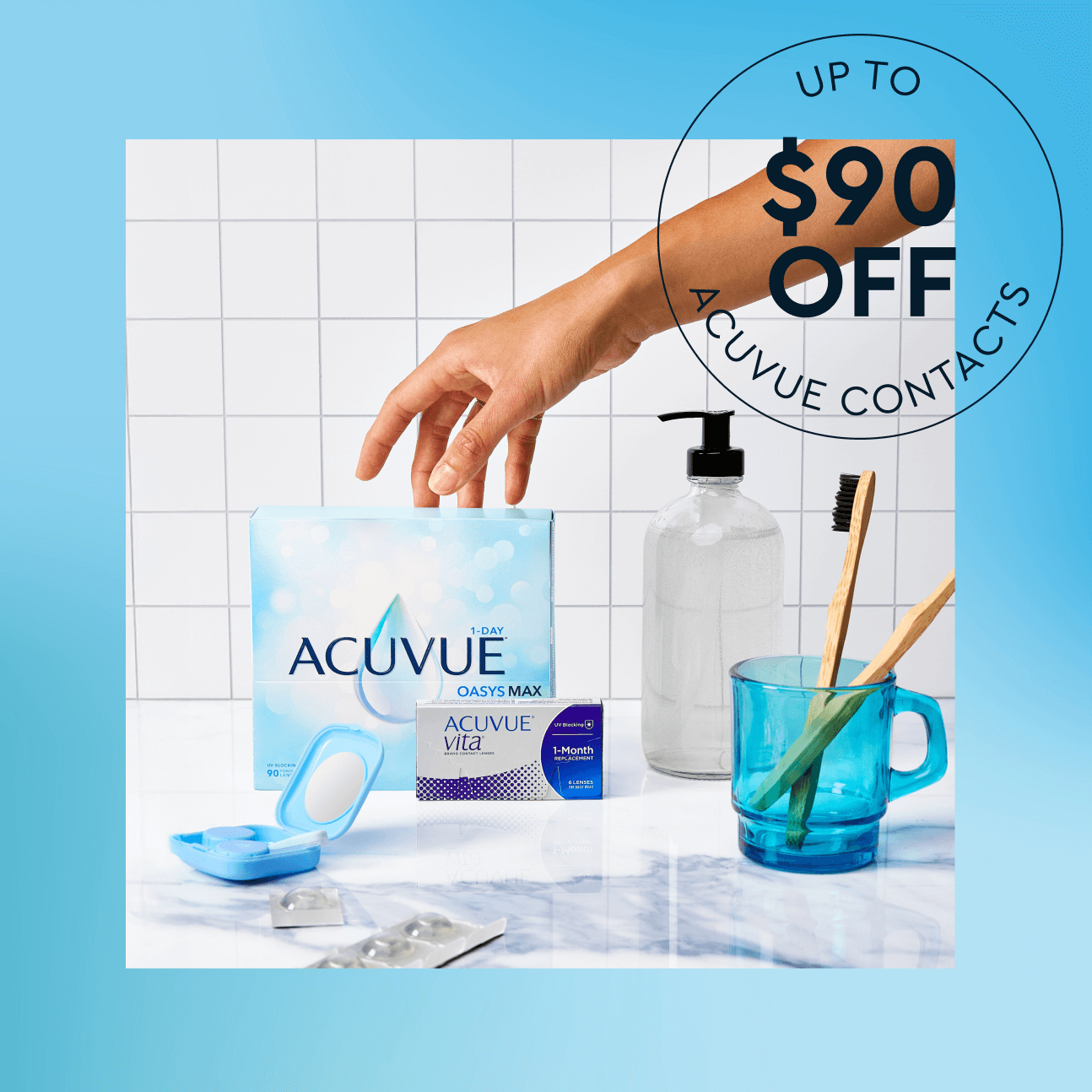 Hand reaching for Acuvue contact lens box with toothbrushes and soap dispenser nearby.