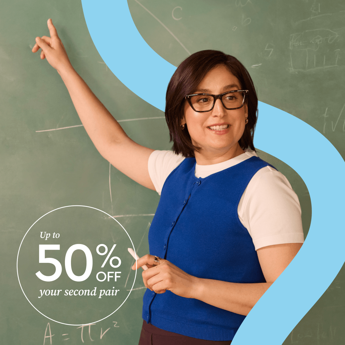 Teacher in front of a green chalkboard
