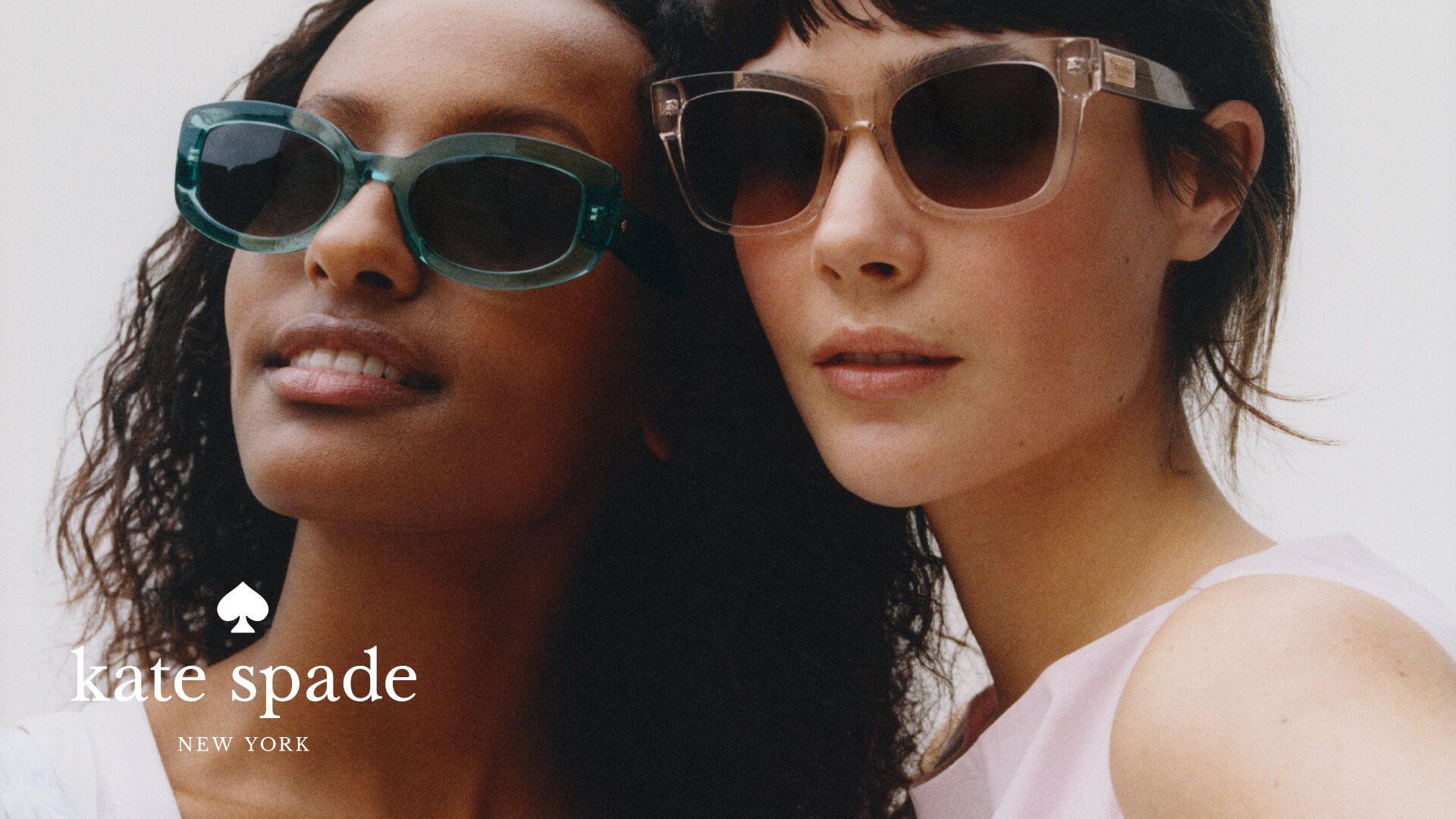 Two young women wearing trendy Kate Spade sunglasses