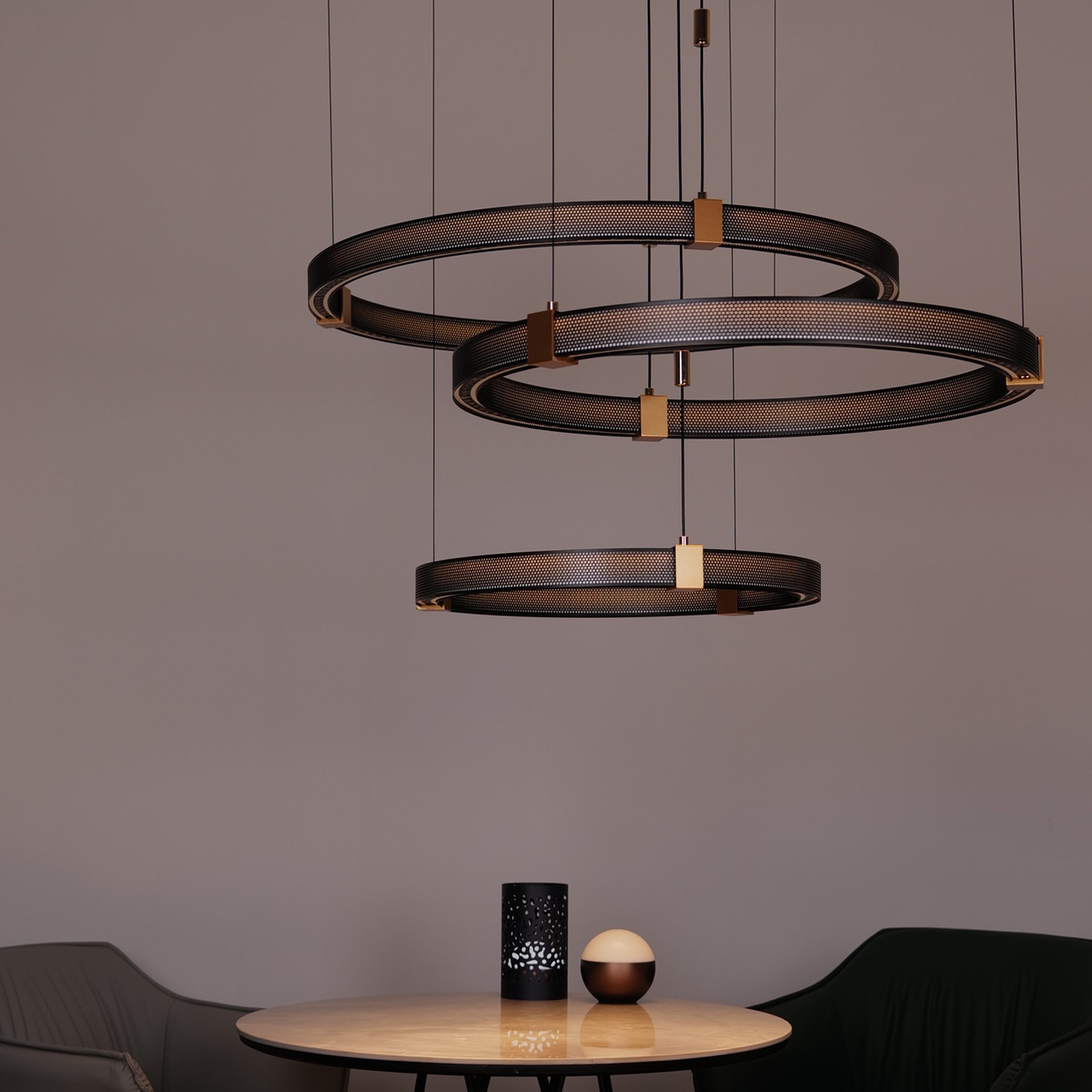 Modern pendant lights above a round table with decorative items.