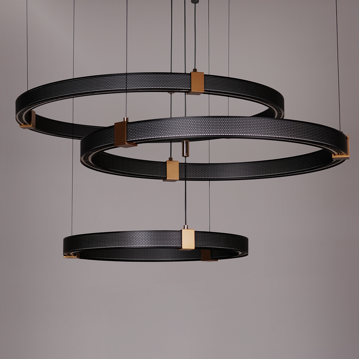 Three black and gold circular pendant lights hanging from the ceiling.