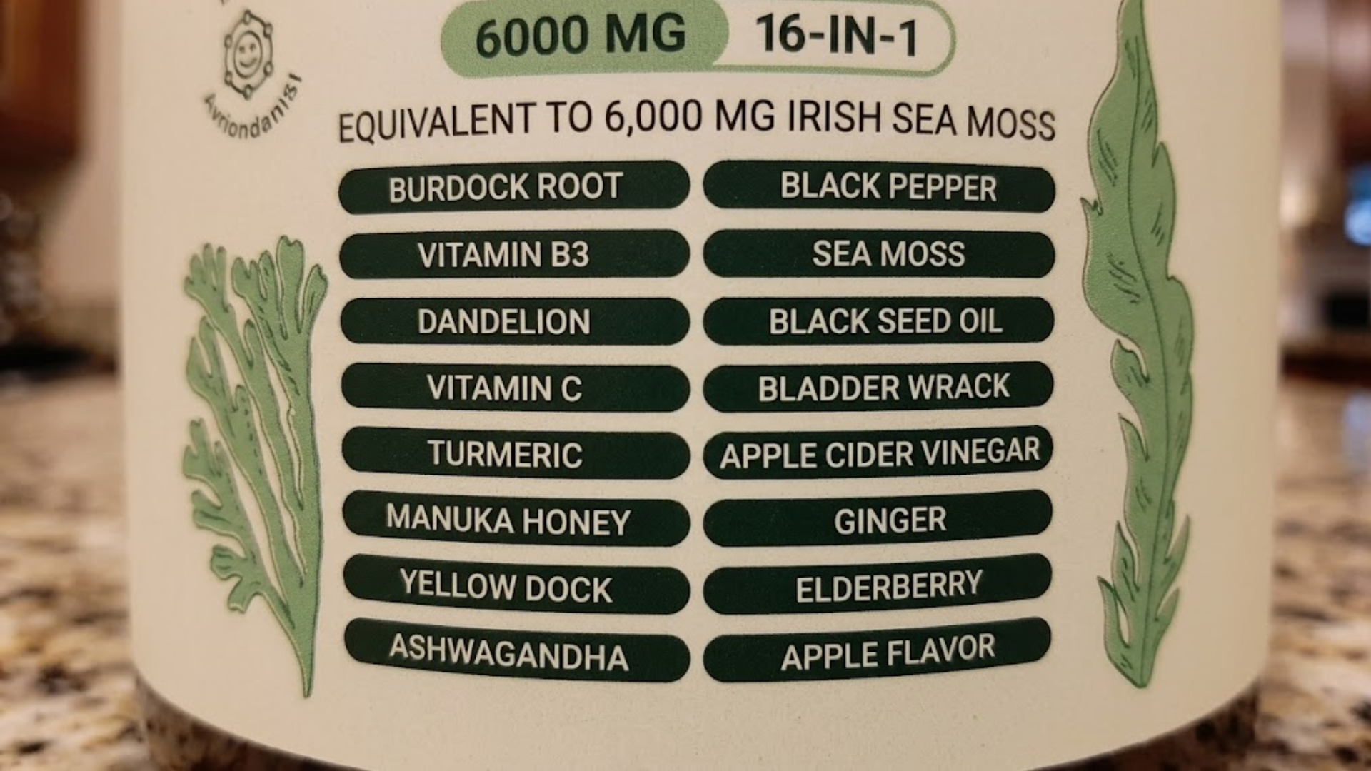 Close-up of a supplement label listing 16 ingredients, including Irish Sea Moss, Burdock Root, and Black Pepper.