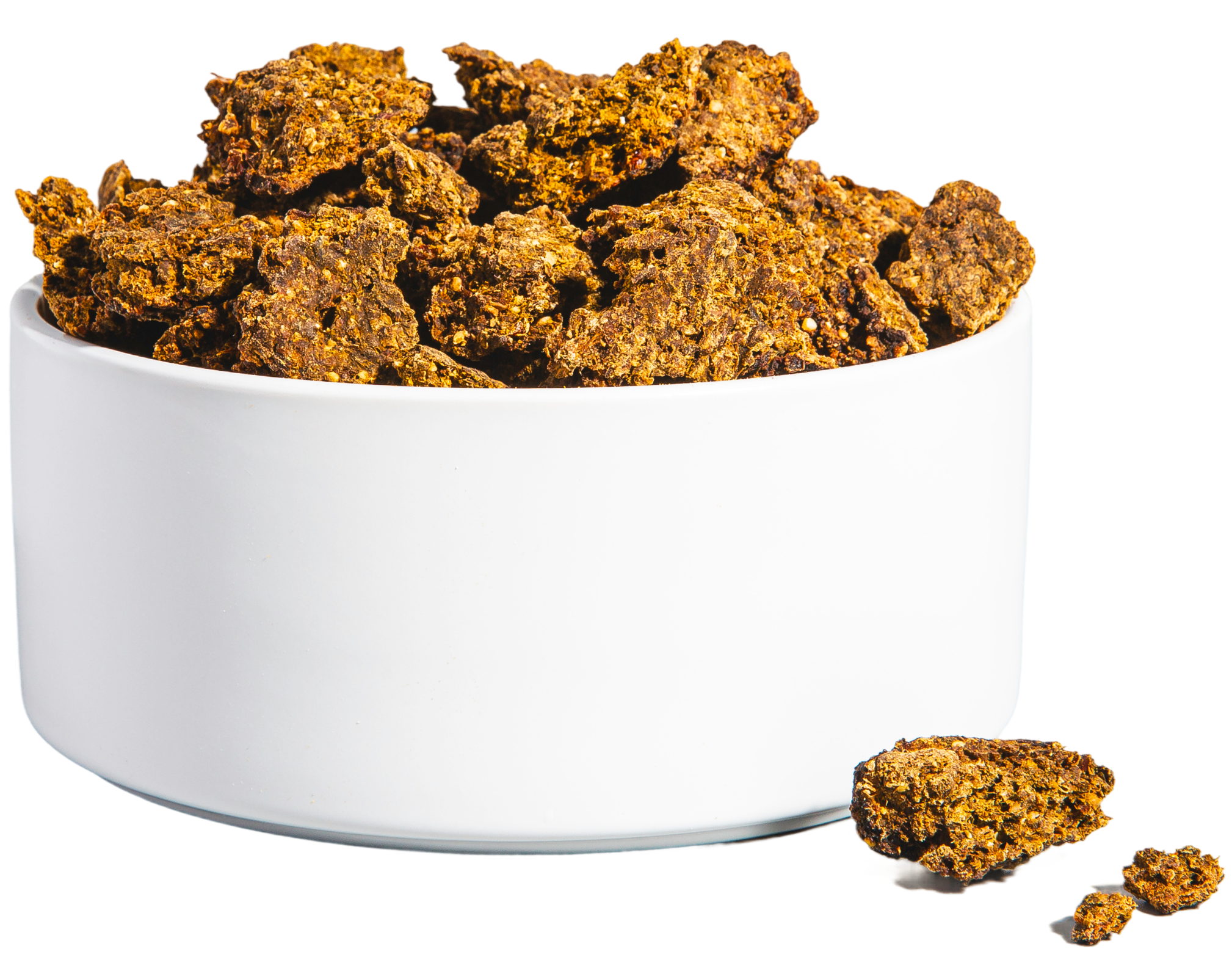 White bowl filled with brown, crumbly chunks on a white background.