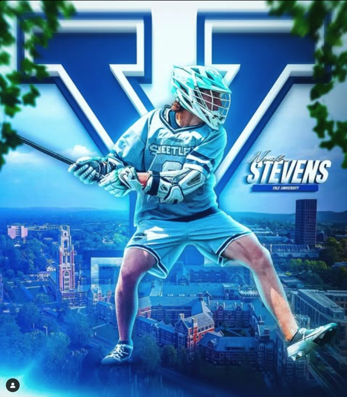 A Yale University lacrosse player in uniform poses with his stick in front of a large blue 'Y'.