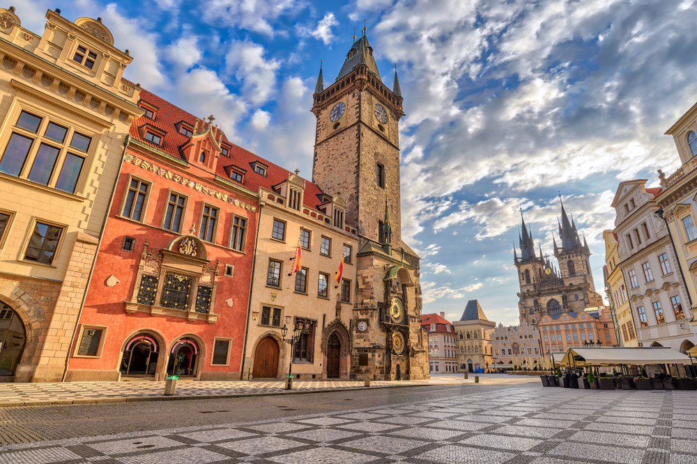 Prague's Old Town Square with its astronomical clock tower and surrounding historical buildings.