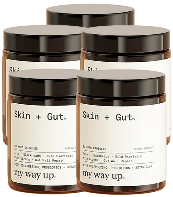 Four jars of 'Skin + Gut' dietary supplement by my way up, arranged in a cluster.