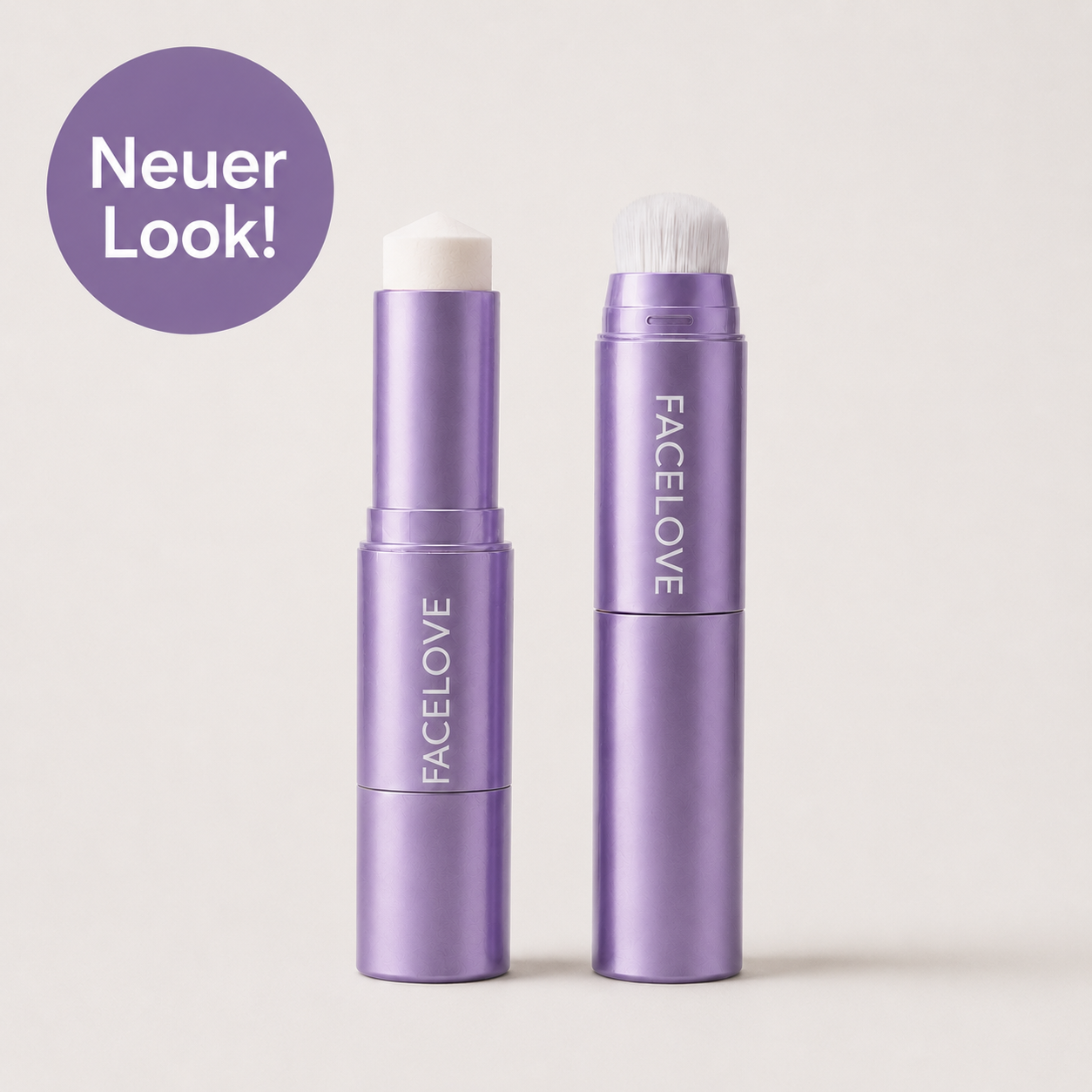 Two white and silver FACELOVED makeup sticks, one with a brush, over a swatch of foundation.