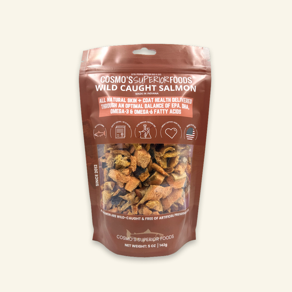 A brown bag of Cosmo's Superior Foods Wild Caught Salmon pet treats with a clear window.