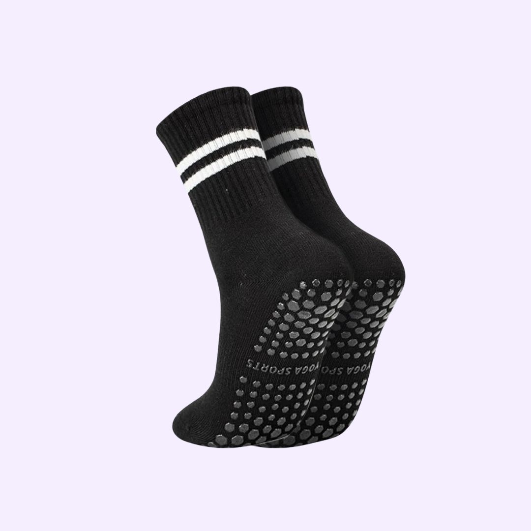 Black socks with white stripes and grippy dots on the soles.
