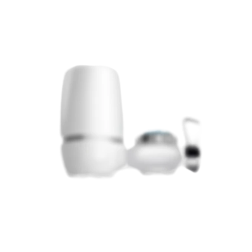 Blurry image of a white cylindrical object and smaller components.