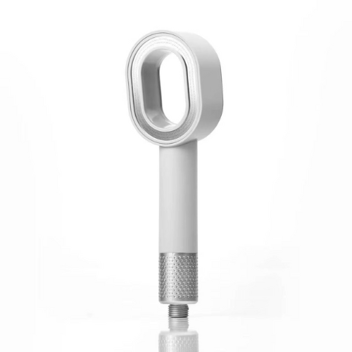 White, modern handheld shower head with a unique oval design.